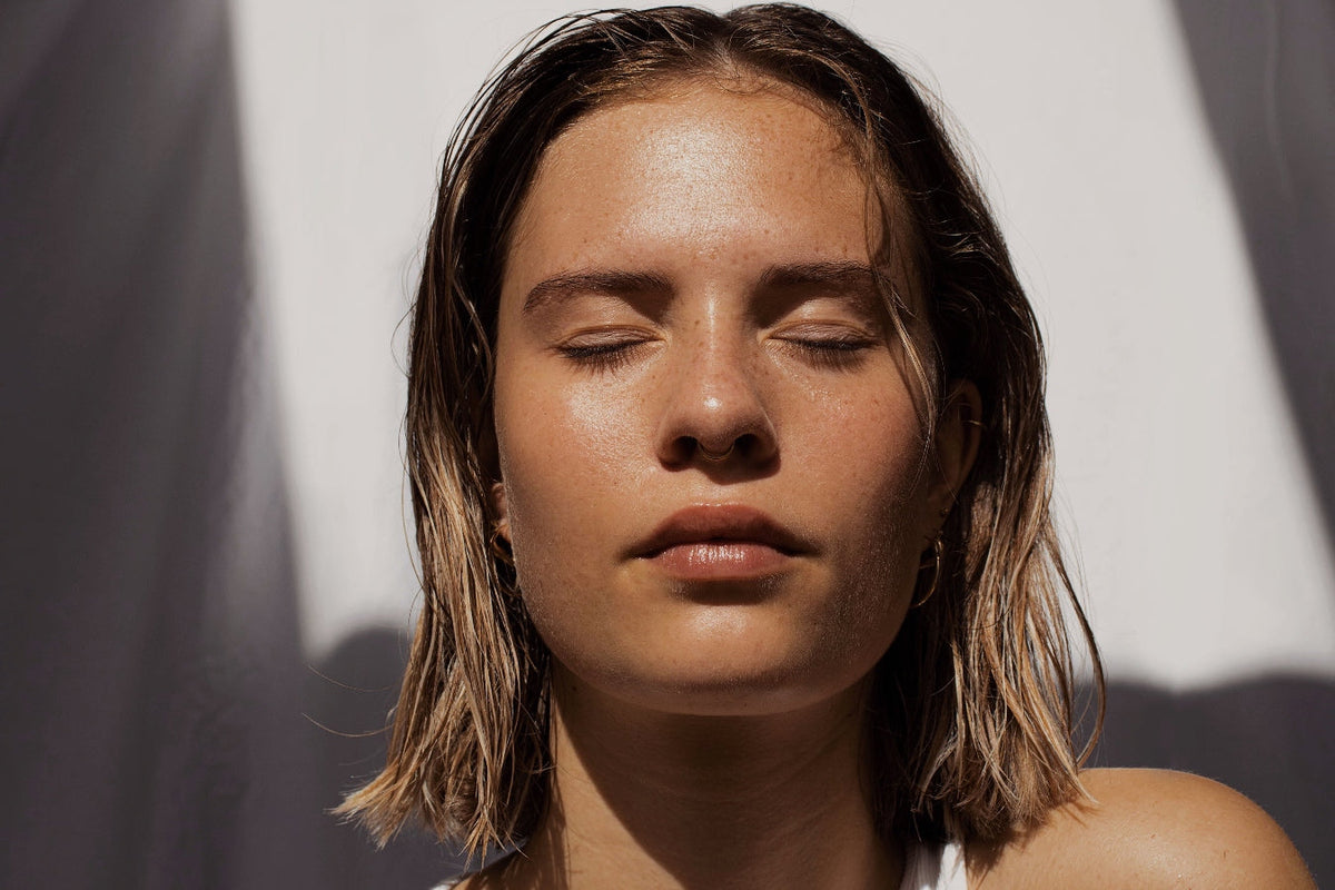 Female With Eyes Closed in Sun